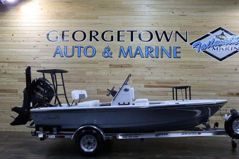 Slide: The Image of 2025 Hewes 16 Redfisher boat displayed at Georgetown Auto & Marine showroom. - 1
