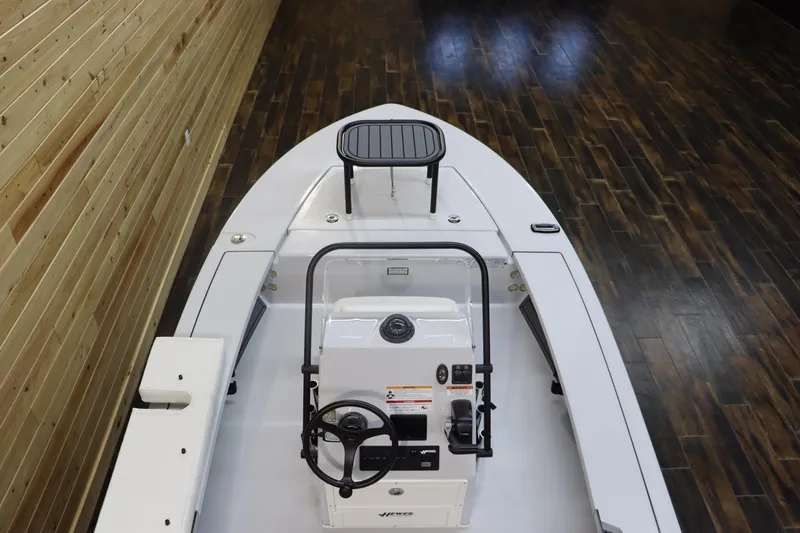Slide: The Image of 2025 Hewes 16 Redfisher boat interior with steering console and seating. - 14