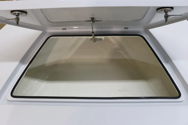 Slide: The Image of Open storage compartment of 2025 Hewes 16 Redfisher boat. - 17