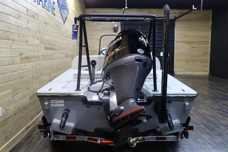 Slide: The Image of 2025 Hewes 16 Redfisher boat with Yamaha outboard motor in showroom. - 3