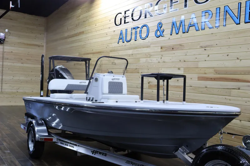 Slide: The Image of 2025 Hewes 16 Redfisher boat displayed at Georgetown Auto & Marine showroom. - 5