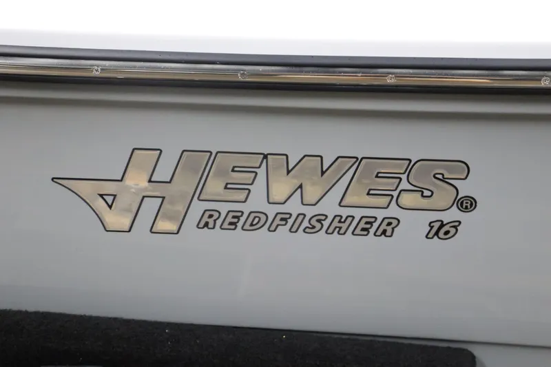 Slide: The Image of Hewes 16 Redfisher 2025 logo on boat exterior. - 6
