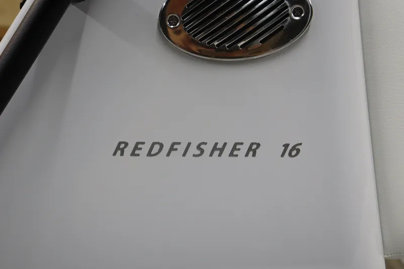 Slide: The Image of 2025 Hewes 16 Redfisher boat detail with logo and vent. - 7