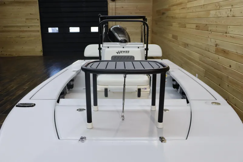 Slide: The Image of 2025 Hewes 16 Redfisher boat interior with center console and seating. - 9