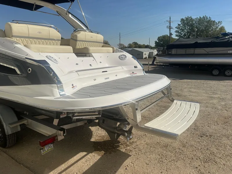 Slide: The Image of 2023 Regal 2800 boat with swim platform and luxurious seating. - 11