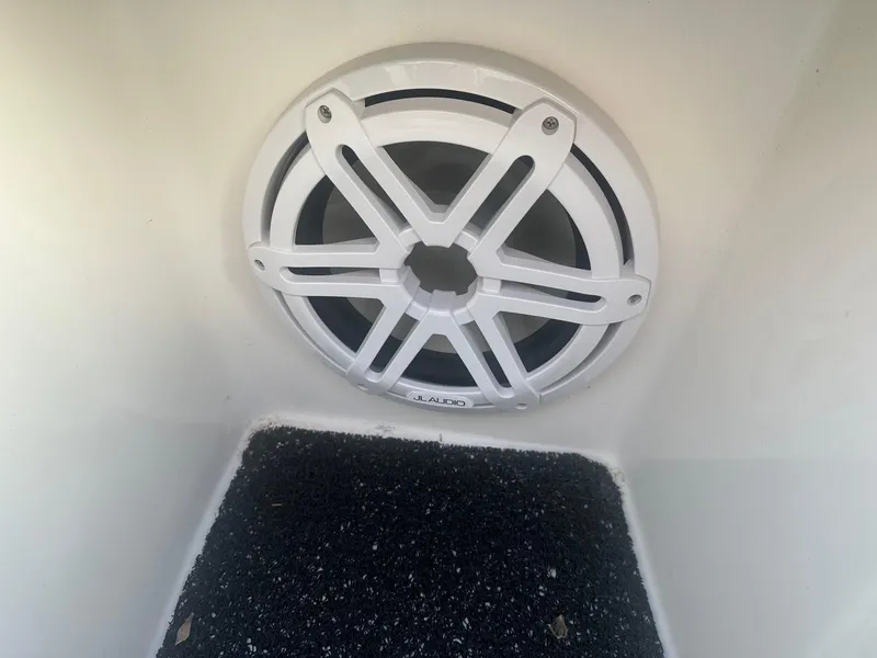 Slide: The Image of JL Audio speaker in 2023 Regal 2800 boat interior. - 15