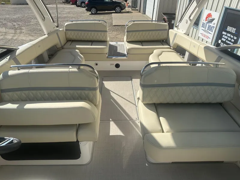 Slide: The Image of 2023 Regal 2800 boat interior with luxurious beige seating and spacious layout. - 16