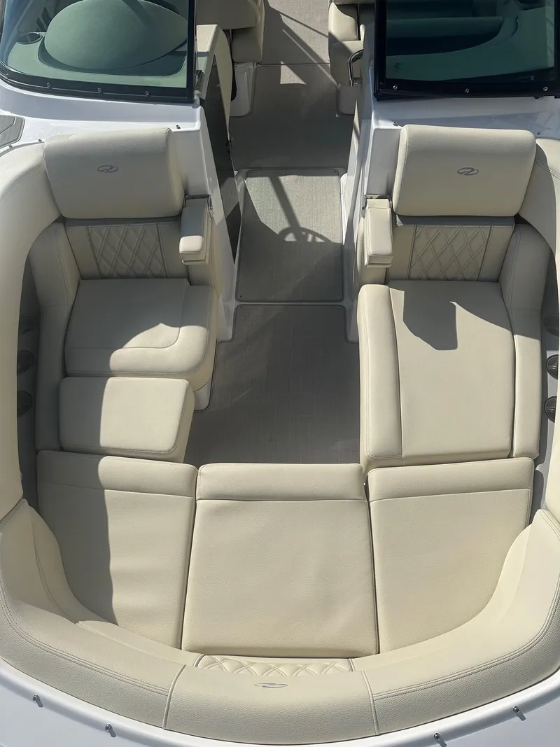 Slide: The Image of 2023 Regal 2800 boat interior with beige leather seating and elegant design. - 19