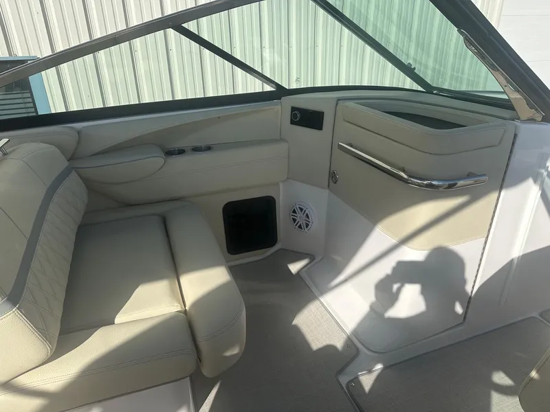 Slide: The Image of Interior of 2023 Regal 2800 boat with beige seating and modern design. - 23