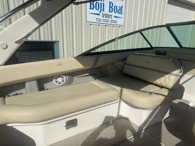 Slide: The Image of 2023 Regal 2800 boat interior with beige seating at Boji Boat Brokers. - 30