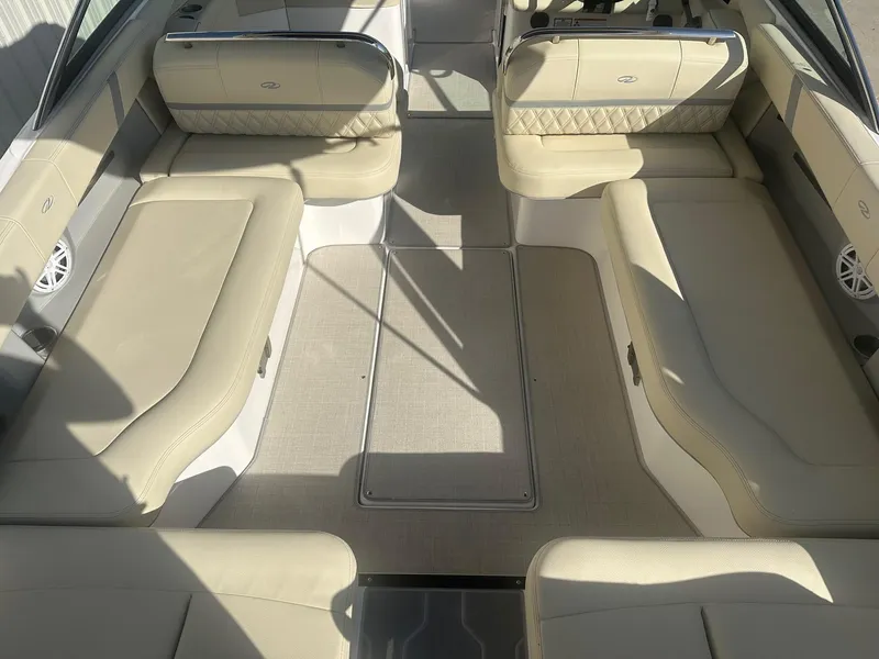 Slide: The Image of 2023 Regal 2800 boat interior with beige seating and spacious layout. - 31