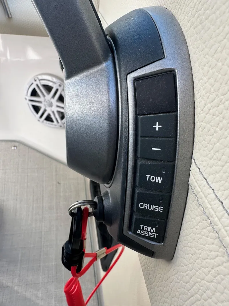 Slide: The Image of Control panel of 2023 Regal 2800 boat with cruise and trim assist features. - 39
