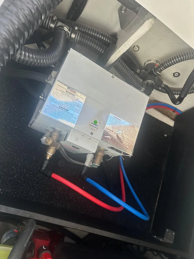 Slide: The Image of 2023 Regal 2800 boat wiring and plumbing system with labeled components. - 46