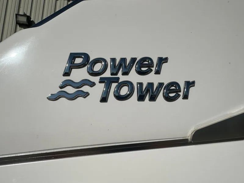 Slide: The Image of Regal 2800 Power Tower logo on white boat, 2023 model. - 49