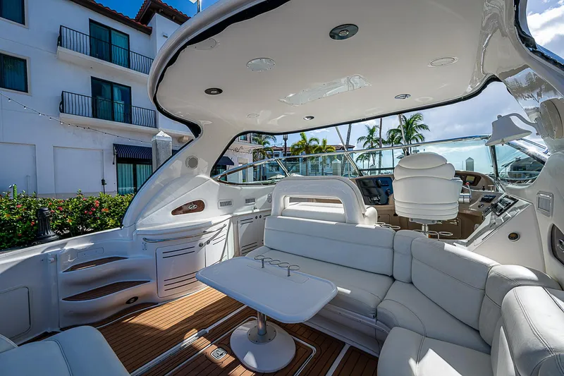 Slide: The Image of Luxurious 2002 Sea Ray 510 Sundancer yacht interior with white seating and modern design. - 18