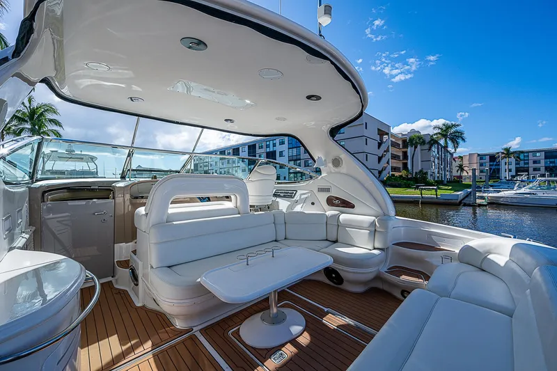 Slide: The Image of Luxurious 2002 Sea Ray 510 Sundancer yacht interior with white seating and wooden flooring. - 20
