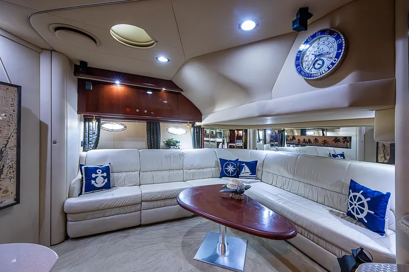 Slide: The Image of Luxurious interior of 2002 Sea Ray 510 Sundancer yacht with plush seating and nautical decor. - 28