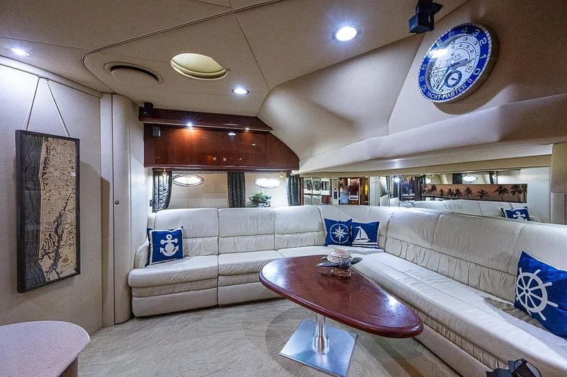 Slide: The Image of Luxurious interior of 2002 Sea Ray 510 Sundancer yacht with plush seating and nautical decor. - 29