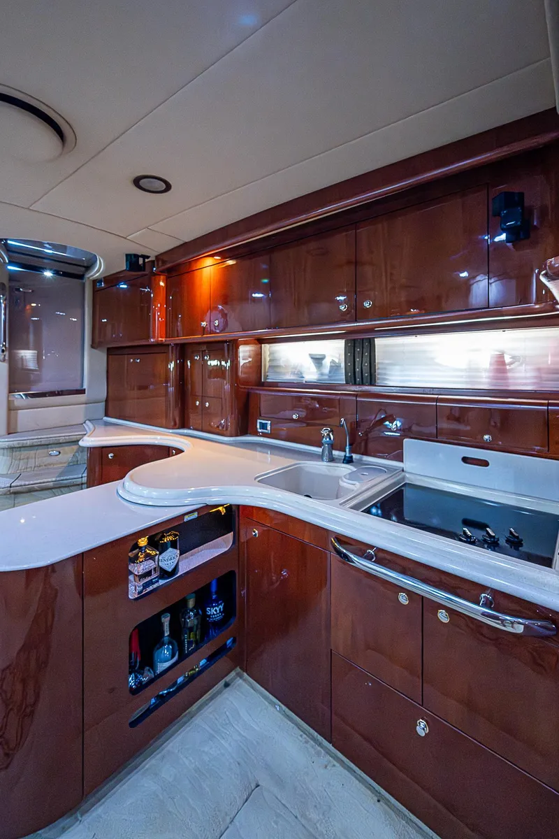 Slide: The Image of Luxurious kitchen interior of 2002 Sea Ray 510 Sundancer yacht with sleek cabinetry. - 31