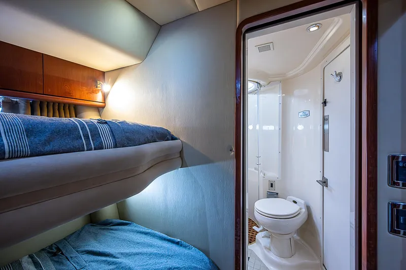 Slide: The Image of 2002 Sea Ray 510 Sundancer cabin with bunk beds and private bathroom. - 34