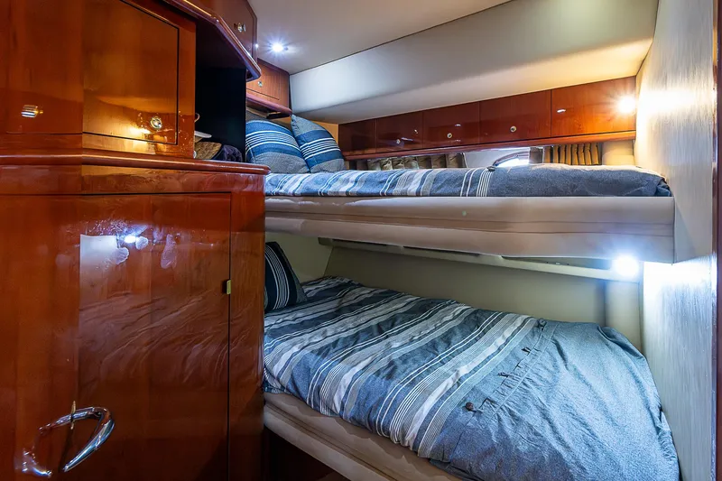Slide: The Image of Luxurious cabin interior of 2002 Sea Ray 510 Sundancer with cozy bunk beds. - 37