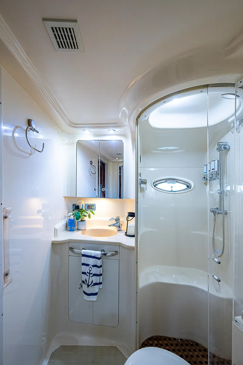 Slide: The Image of Luxurious bathroom in 2002 Sea Ray 510 Sundancer yacht with modern fixtures. - 38