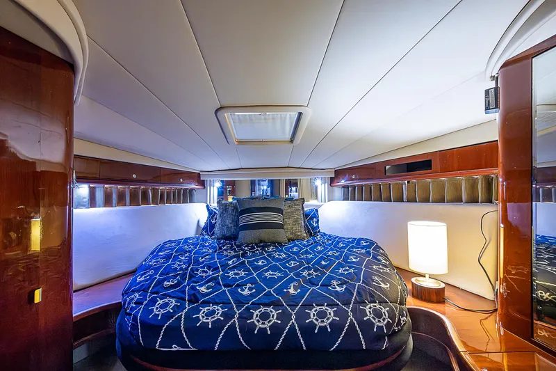 Slide: The Image of Luxurious cabin interior of 2002 Sea Ray 510 Sundancer yacht with nautical bedding. - 41