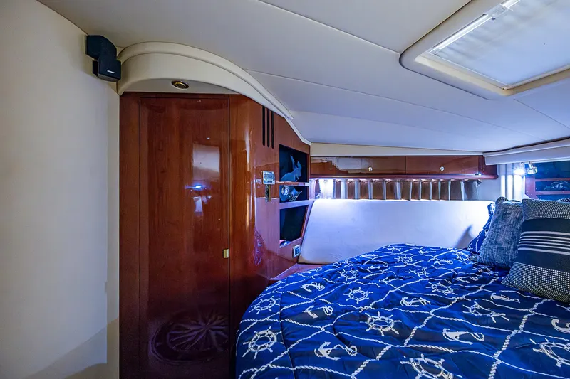 Slide: The Image of Luxurious cabin interior of 2002 Sea Ray 510 Sundancer yacht with nautical bedding. - 43
