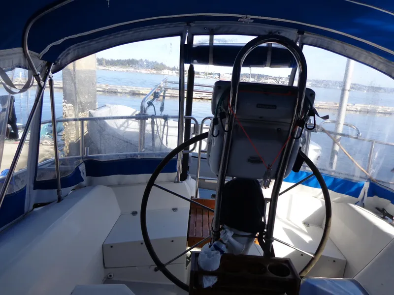 Slide: The Image of Interior view of 1991 Catalina MK-l Double Cabin sailboat cockpit with steering wheel. - 11