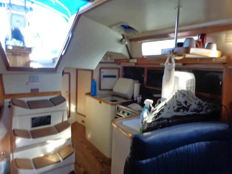 Slide: The Image of Interior of 1991 Catalina MK-l Double Cabin with kitchen and seating area. - 21