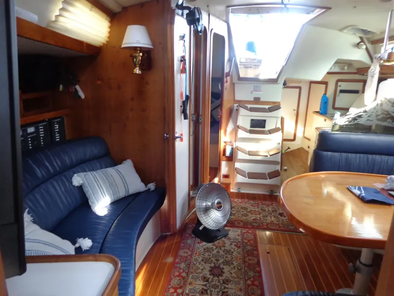 Slide: The Image of Interior of 1991 Catalina MK-l Double Cabin with cozy seating and wooden finishes. - 26