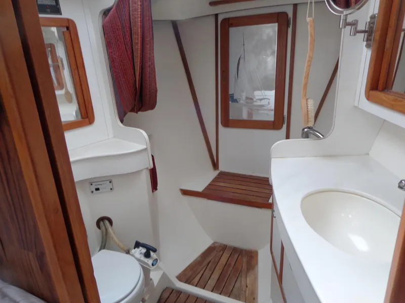 Slide: The Image of 1991 Catalina MK-l Double Cabin bathroom with wooden accents and compact design. - 24