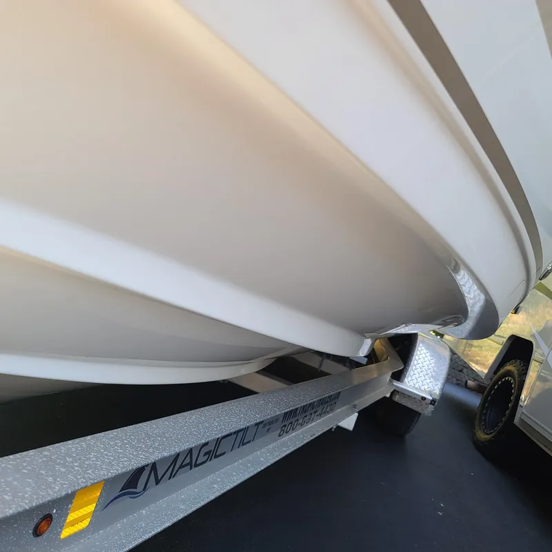 Slide: The Image of 2015 Pursuit DC 235 Dual Console boat on Magic Tilt trailer. - 14