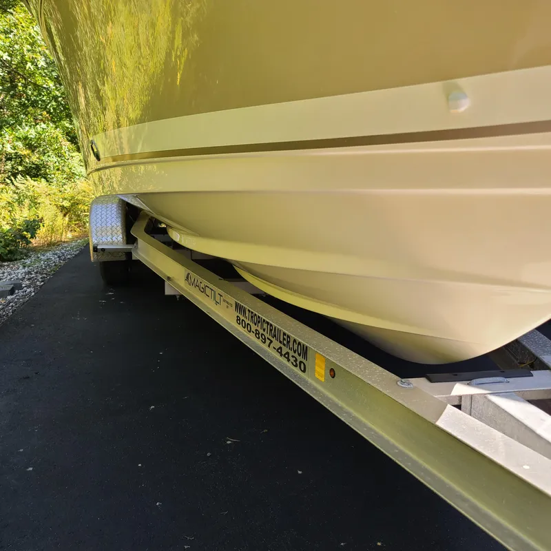 Slide: The Image of 2015 Pursuit DC 235 Dual Console boat on trailer, side view. - 15