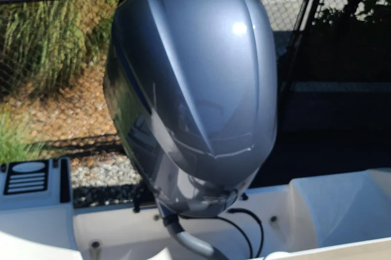 Slide: The Image of 2015 Pursuit DC 235 Dual Console boat engine, close-up view. - 25