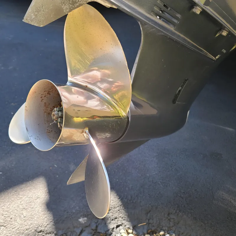 Slide: The Image of Close-up of a 2015 Pursuit DC 235 Dual Console boat propeller. - 3