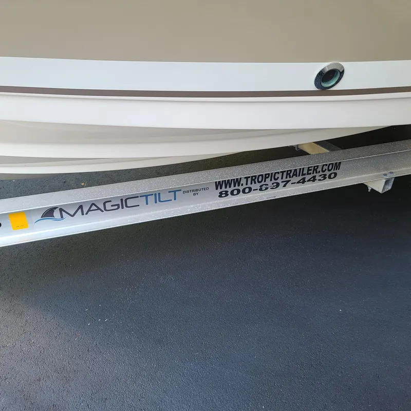 Slide: The Image of 2015 Pursuit DC 235 Dual Console on Magic Tilt trailer. - 7