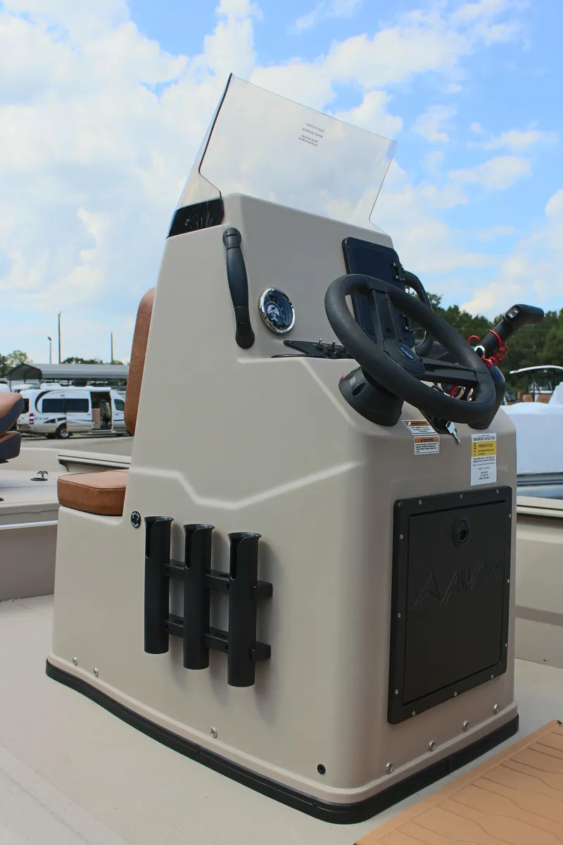 Slide: The Image of 2025 Avid 18 Rogue CC boat console with steering wheel and controls. - 11