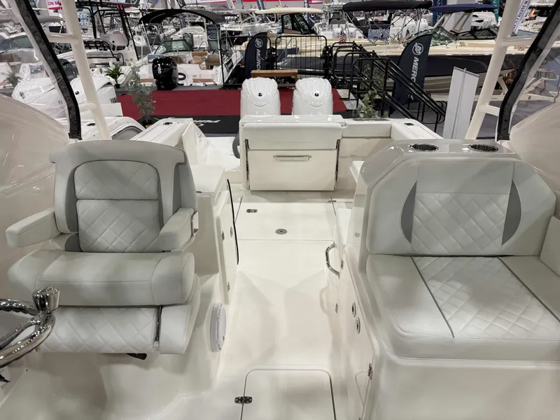 Slide: The Image of 2025 Pursuit DC 266 Dual Console boat interior with luxurious seating and modern design. - 4