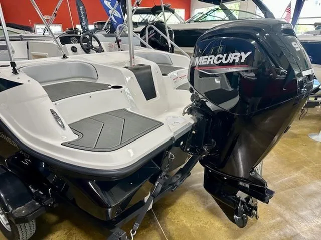 Slide: The Image of 2025 Bayliner Element M17 boat with Mercury outboard motor in showroom. - 3