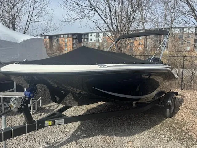 Slide: The Image of 2025 Bayliner Element M17 boat on trailer, covered, outdoors. - 7