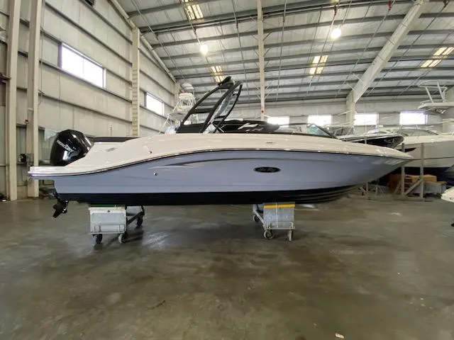 The Image of 2025 Sea Ray SPX 230 Outboard in a warehouse. - 0