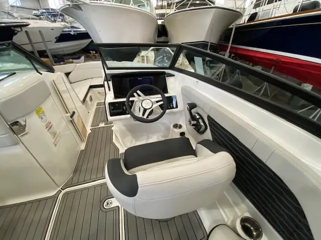Slide: The Image of Interior of 2025 Sea Ray SPX 230 Outboard with modern helm. - 10