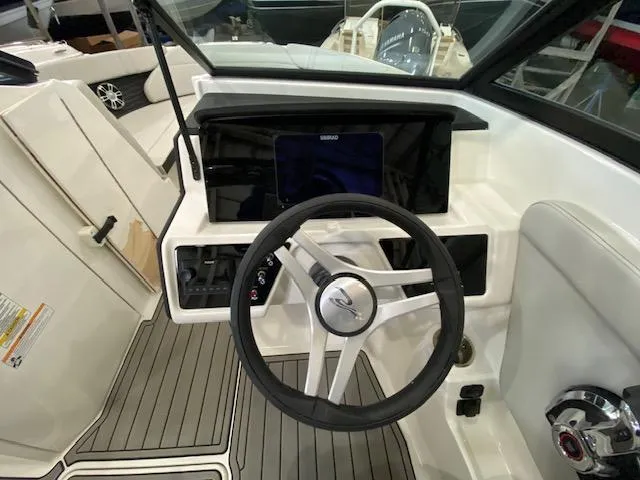 Slide: The Image of Interior view of 2025 Sea Ray SPX 230 Outboard cockpit. - 12