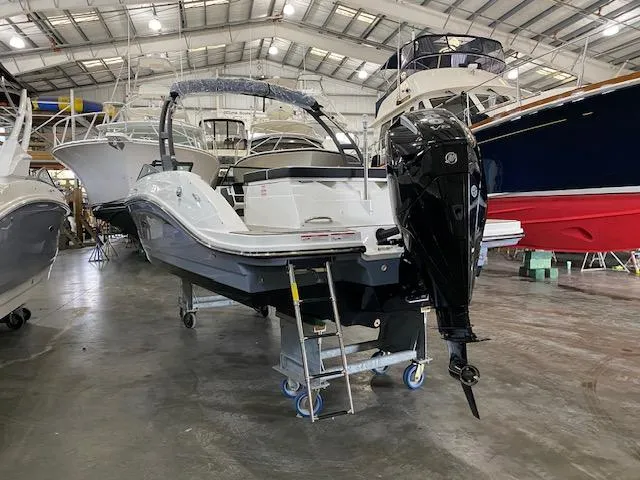 Slide: The Image of 2025 Sea Ray SPX 230 Outboard in a boatyard. - 2