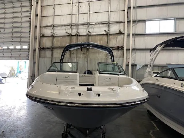 Slide: The Image of 2025 Sea Ray SPX 230 Outboard in a warehouse. - 5