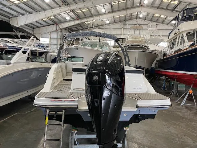 Slide: The Image of 2025 Sea Ray SPX 230 Outboard in a boatyard. - 6