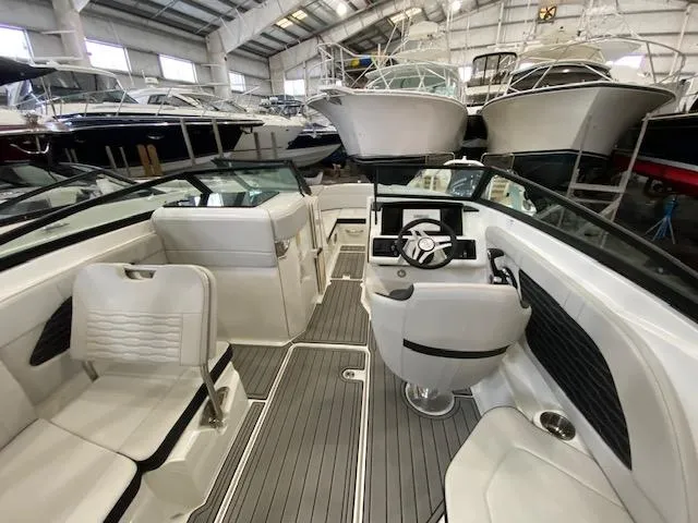 Slide: The Image of Interior of 2025 Sea Ray SPX 230 Outboard in a boat warehouse. - 9