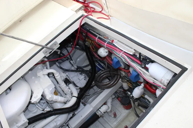 Slide: The Image of 1985 Viking Express engine compartment with wiring and components. - 21