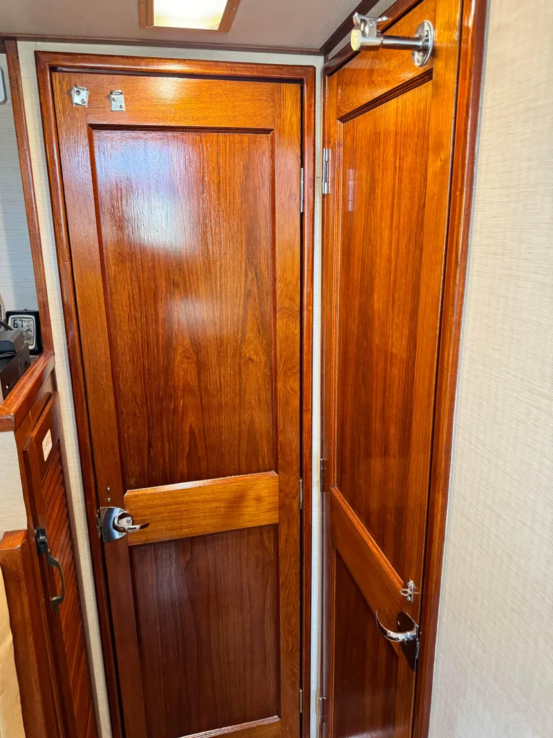 Slide: The Image of Wooden interior door of a 1985 Viking Express boat. - 24